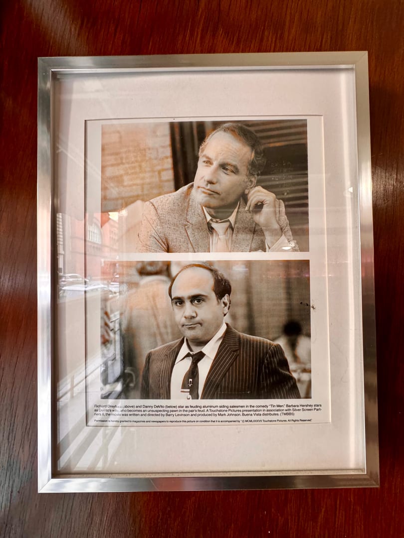Framed black and white photos of Richard Dreyfuss and Danny DeVito from the movie "Tin Men".